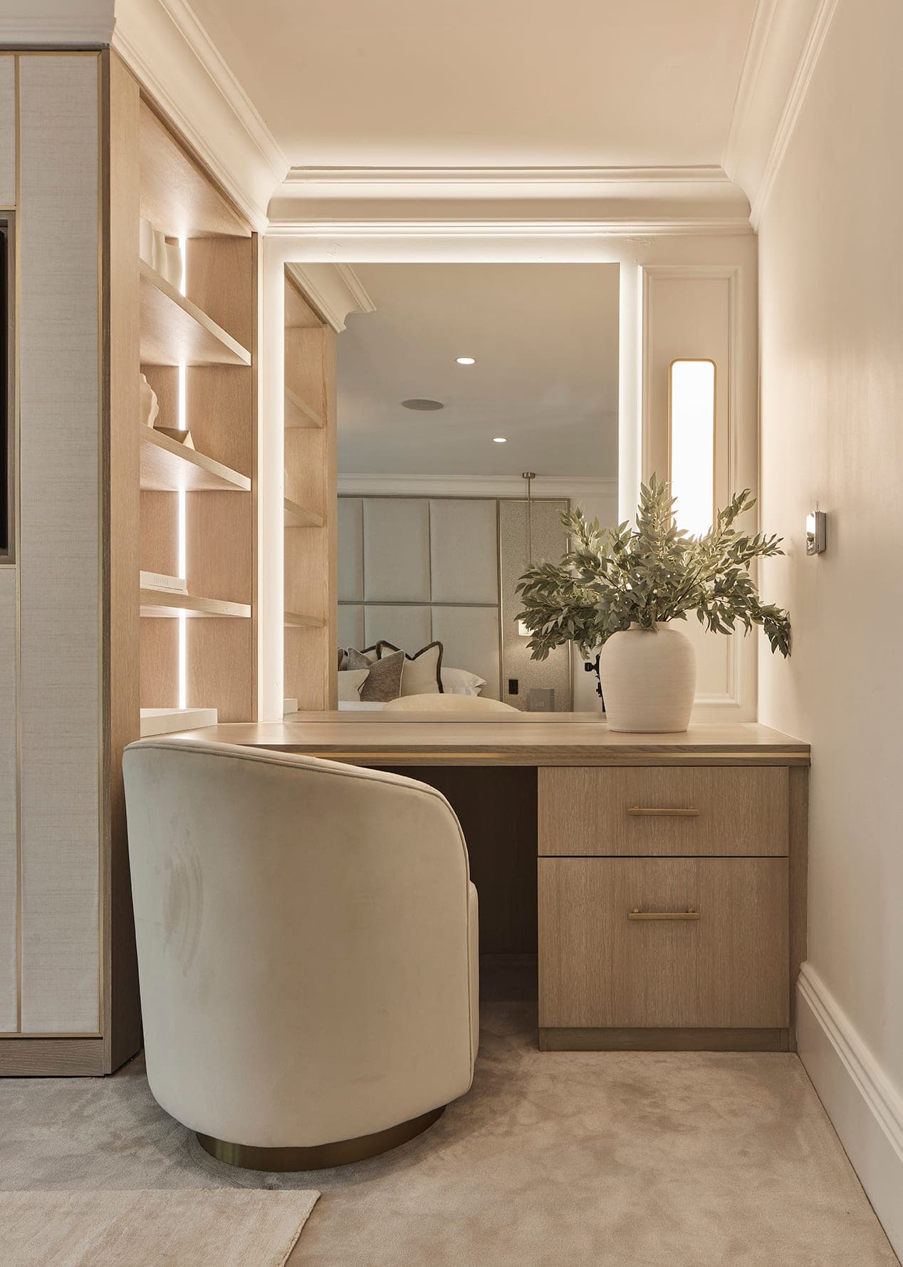 Dressing room with backlit shelving and a dressing table, Prestbury family home